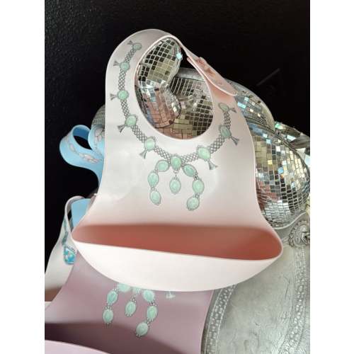 The Turquoise Squash Silicone Bib in Pink