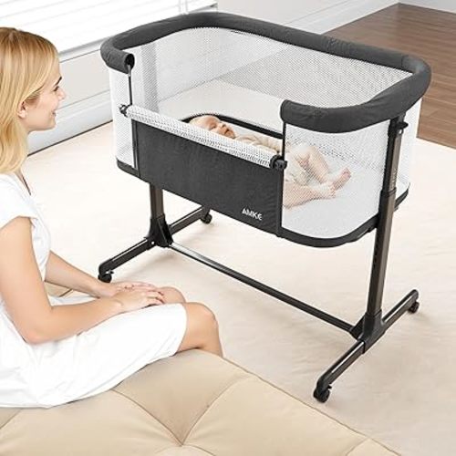 AMKE Baby Bassinet Bedside Sleeper, Portable Bassinet with Wheels, 6-Height Adjustable & Fold Down Side, Full Breathable Mesh Bedside Crib for Baby with Mattress Pad, Easy to Install, Dark Grey