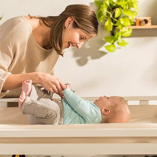Naturepedic Organic Contoured Changing Pad - Easy to Clean, Lightweight & Portable - Comfort 4-Sided Waterproof Baby Diaper Changing Pad for Dresser or Changing Table - 16" x 31"