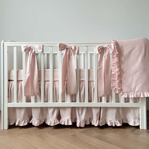 Elegant Pale Pink Nursery Collection: Ruffled Crib Skirt, Fitted Sheet, Baby Blanket with Decorative Bows
