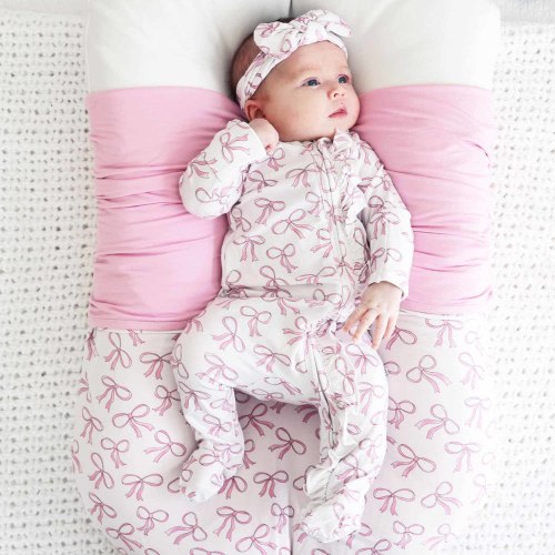 Blushing Bows Ruffle Zipper Footie*