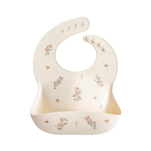 mushie Silicone Baby Bib | Adjustable Fit Waterproof Bibs (Pink Flowers) | Ages 4-24 months, Machine washable, Adjustable neck strap, Deep front pocket