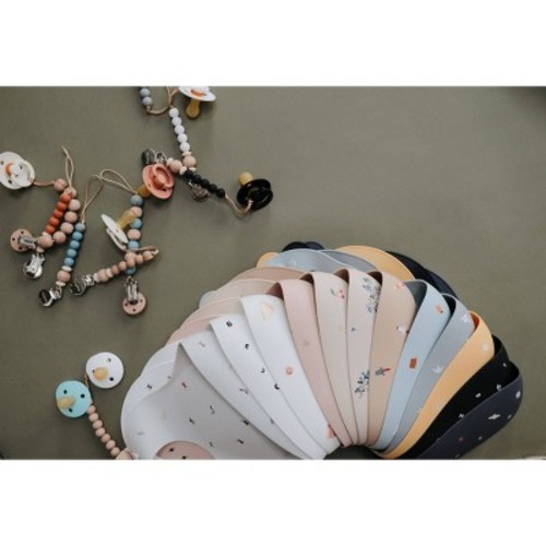 Mushie Silicone Baby Bib, Color: Lilac Flowers, Cambridge, or shifting sand