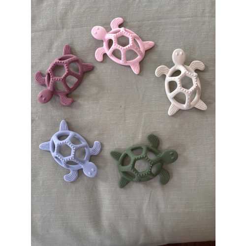 Teether by baby turtle snaps. Is babies teething solution. Highest and safest materials. May be sterilized. Cutest colors.