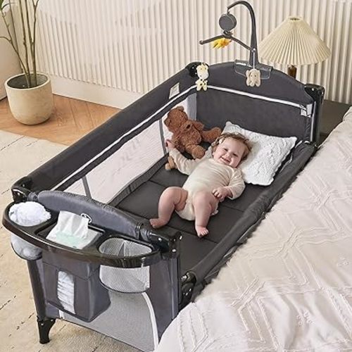 MOOITZ Baby Bassinet Bedside Crib, 6-in-1 Pack and Play with Bassinet, 4 Height Adjustable Bedside Crib, Newborn Portable Bassinet with Wheels, U-Shaped Diaper Table, Music Box & Hanging Toys