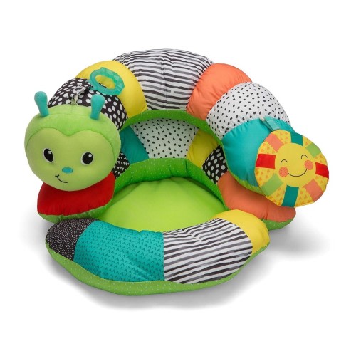 Pillow support for newborns and older babies, with toys.