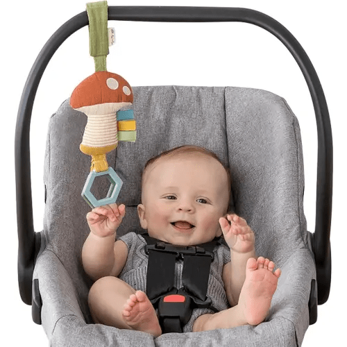 Itzy Ritzy Jingle Travel Toy for Stroller, Car Seat or Activity Gym - Baby Hanging Toy Features Jingle Sound, Clinking Rings & Adjustable Attachment Loop (Mushroom)