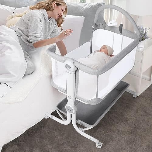 Cowiewie Baby Bassinet Bedside Sleeper with Storage Basket,Wheels and Toys, Easy Folding Portable Bassinet with Wheels Adjustable Height Portable Bassinets for Newborn