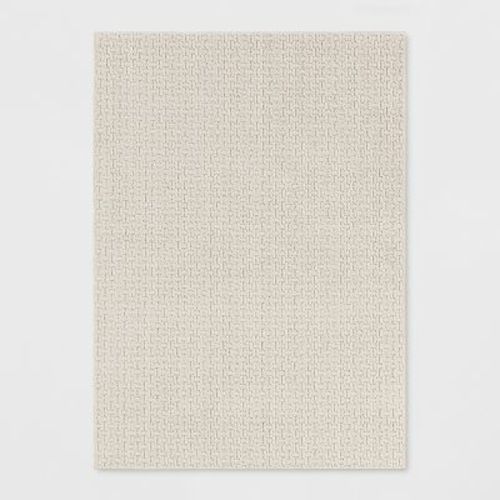 5'x7' Washable Solid Machine Tufted Area Rug Tan - Threshold™