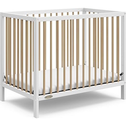 Graco Teddi 4-in-1 Convertible Mini Crib with Bonus Water-Resistant Mattress (White with Driftwood) – GREENGUARD Gold Certified, 2.75-Inch Mattress Included, Convenient Size, Easy 30-Minute Assembly