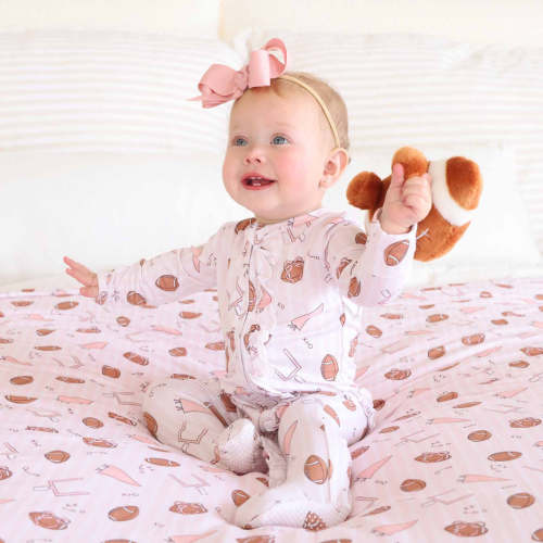 Tiny Touchdowns Ruffle Zipper Footie | Pink