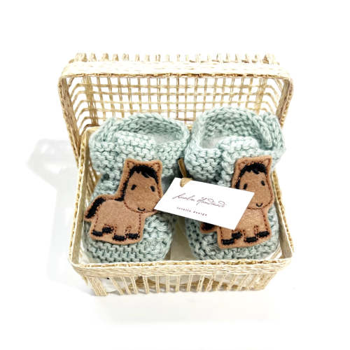 pony booties in a basket