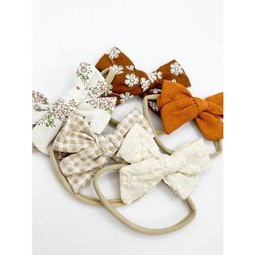Baby Headband Bow, Neutral fabric bow with soft stretchy nylon band.