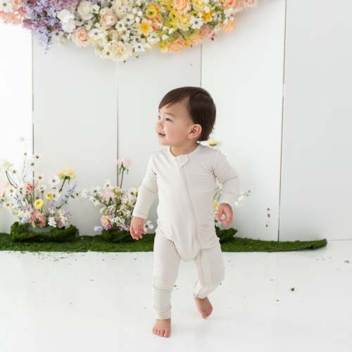 6-12M- Kyte Baby Zippered Romper in Ecru
