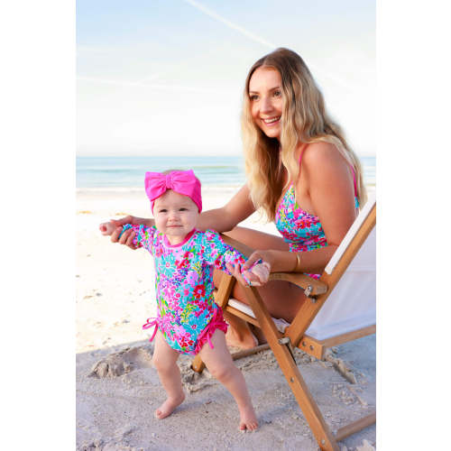Long Sleeve Rash Guard With Ruffle Bottom in Petal Splash | Caden Lane