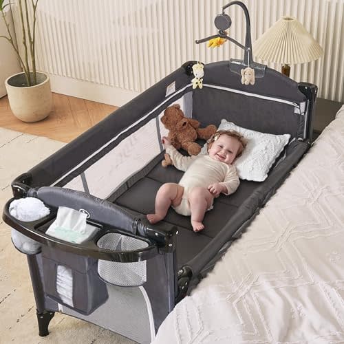MOOITZ Baby Bassinet Bedside Crib, 6-in-1 Pack and Play with Bassinet, 4 Height Adjustable Bedside Crib, Newborn Portable Bassinet with Wheels, U-Shaped Diaper Table, Music Box & Hanging Toys