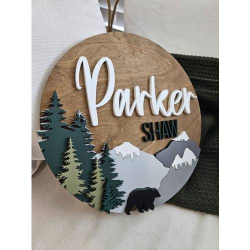 Round wilderness woodland forest theme boys room nursery wood circle name sign wall hanging. Trees and mountains baby shower gift