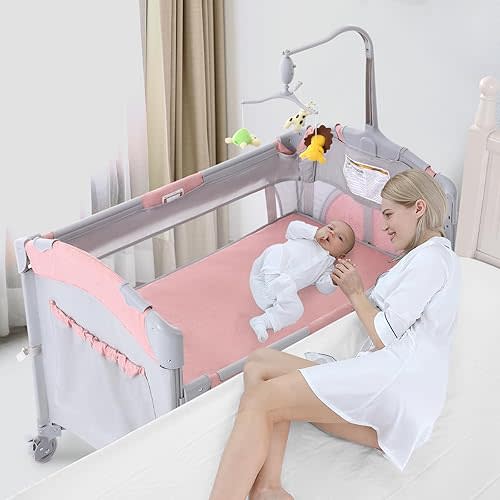 Jaoul 5 in 1 Baby Crib, Baby Bassinet Beside Sleeper, Pack and Play with Bassinet and Changing Table Portable Travel Baby Playpen with Toys & Music Box, Mattress for Girl Boy Infant Newborn Pink