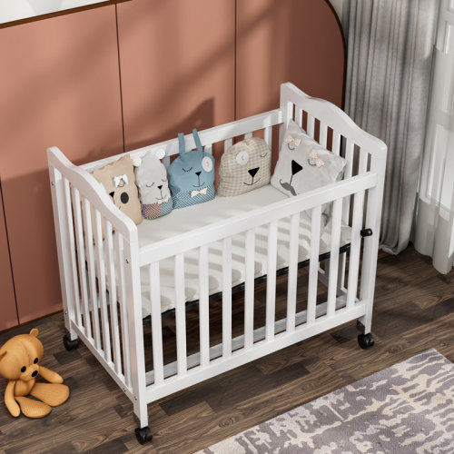 Harriet Bee Hinojosa Mini Crib With 3 Position Adjustable Mattress Board & Reviews | Wayfair