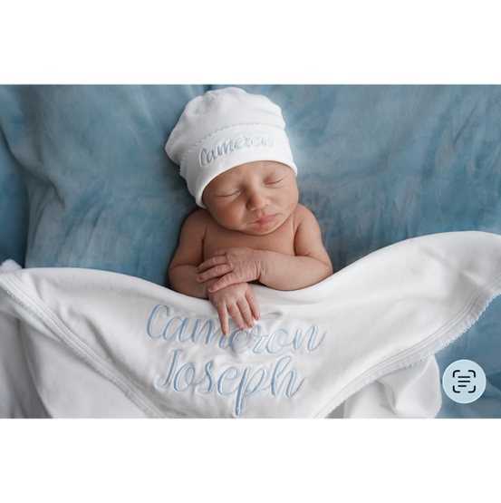 White with Sage Personalized Stanley Howard Kowalczyk Baby Coming-Home Set – Caprilina - Hudson font, #2 monogram, Sage green, 5 piece newborn set. Footie: monogram style 2 color sage Bib: 1st and middle name Stanley Howard in Hudson font sage color Hat: