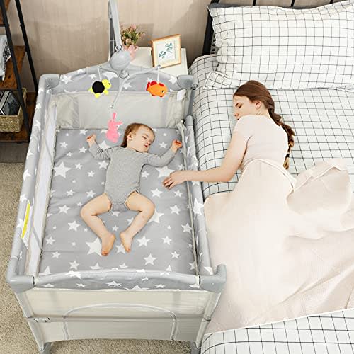 HONEY JOY Pack and Play with Bassinet, 5-in-1 Baby Bedside Sleeper w/Diaper Changing Table & Storage Bag, Toy Arch & Music Box, Detachable Side Rail, Portable Baby Play Yard w/Carry Bag(Beige)