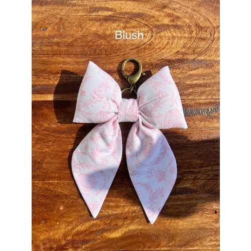Adorable hand sewed puff bow keychains perfect for any bag or purse!