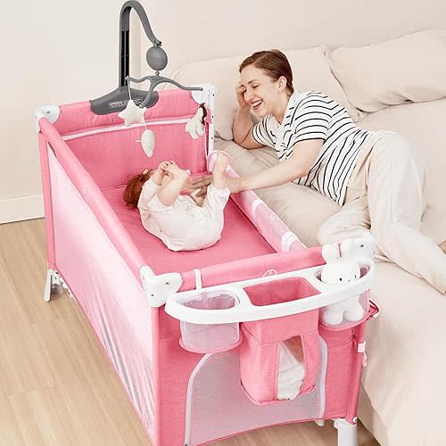 ANGELBLISS 5 in 1 Baby Bassinet Bedside Crib, Beside Sleeper with Diaper Changer& Removable Rocker, Pack and Play Bassinet, Easy Folding Portable Playpen Bassinet with Mobile, Sheet& Mattress (Pink)