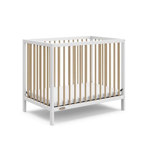 Graco Teddi 4-in-1 Convertible Mini Crib with Bonus Water-Resistant Mattress (White/Driftwood) – GREENGUARD Gold Certified, 2.75-Inch Mattress Included, Ideal for Small Spaces, Easy 30-Minute Assembly