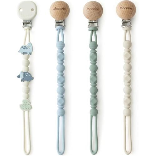 Moonkie Silicone Pacifier Clips for Baby – Durable One-Piece Binky Holder, Mixed Styles Paci Clips, Baby Essentials for Newborn Boys & Girls - 4 Pack (Dino Roars)