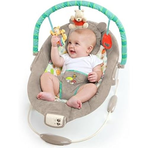 Bright Starts Disney Baby Winnie the Pooh Baby Bouncer Soothing Vibrations Deluxe Infant Seat - Faux Suede, Music, Removable -Toy Bar, 0-6 Months 6-20 lbs (Dots & Hunny Pots)
