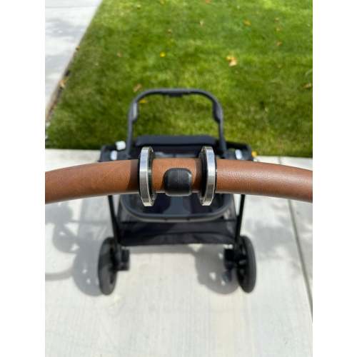 StrollerRoller: Easily roll your Nuna Triv Next stroller in and out of your trunk and protect the handle too! For Nuna Triv Next only