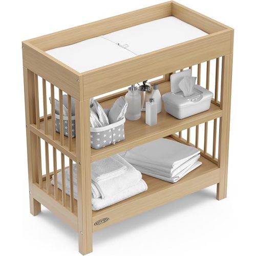 Graco Teddi Changing Table with Water-Resistant Changing Pad (Driftwood) - GREENGUARD Gold Certified, Includes Bonus Water-Resistant Changing Pad with Safety Strap, 2 Shelves, Easy-to-Match