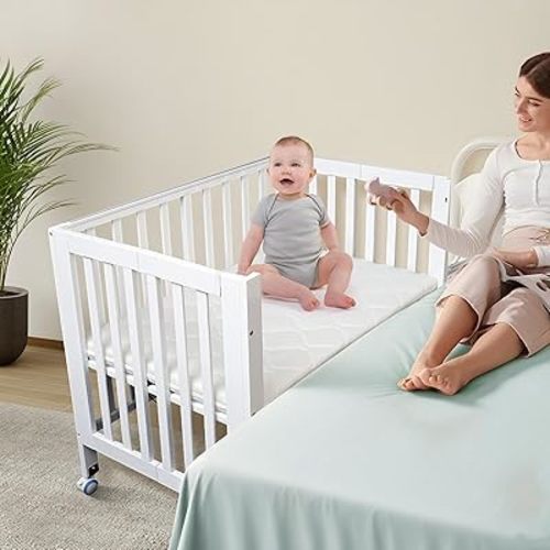 Portable Baby Bedside Bassinet,Foldable Mini Crib with Drop Side,and Mattress,Breathable Liner Included,3 Adjustable Heights Bassinet Bedside Sleeper,2025 Wood Baby Bed,White