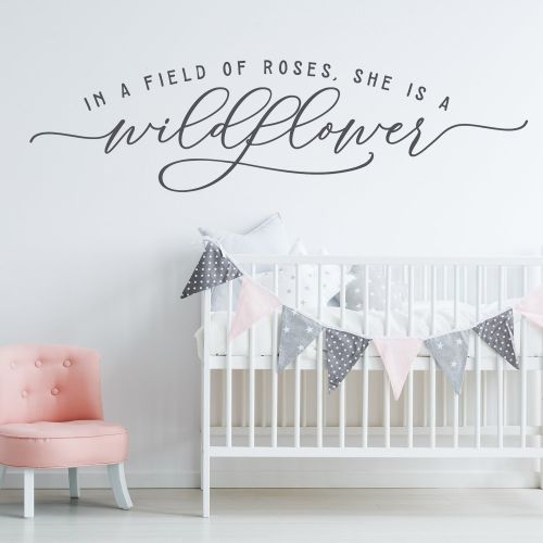 In a field of roses she is a wildflower Wall Decal Above the crib Art Nursery Decor Wall Decal Baby Girl Quote Decal Vinyl Sticker