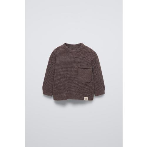 Sweater with round neck and long sleeves with cuffs. Back button closure. Patch pocket at chest. Label appliqué at hem. - Dark brown | ZARA United States