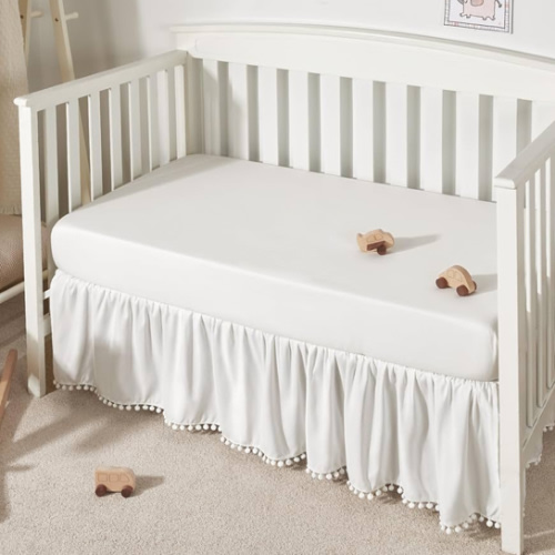 TILLYOU Baby Crib Skirt Girls Boys, Ruffled Bed Skirt with Pompoms, 28”x 52”, 14'' Drop, White