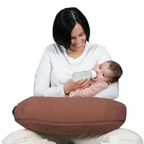 Boppy Nursing Pillow Luxe - Ergonomic Bottle & Breastfeeding Pillow with High Lift & Firm Support - Water-Resistant with Washable Cotton Muslin Cover - Baby Safety Alliance Verified - Chestnut