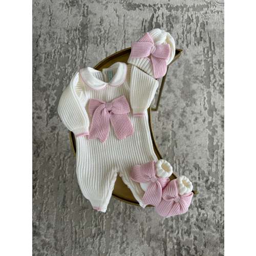 Beautiful knitted Merino Wool Ivory/White Baby Girl Romper with Bow details.