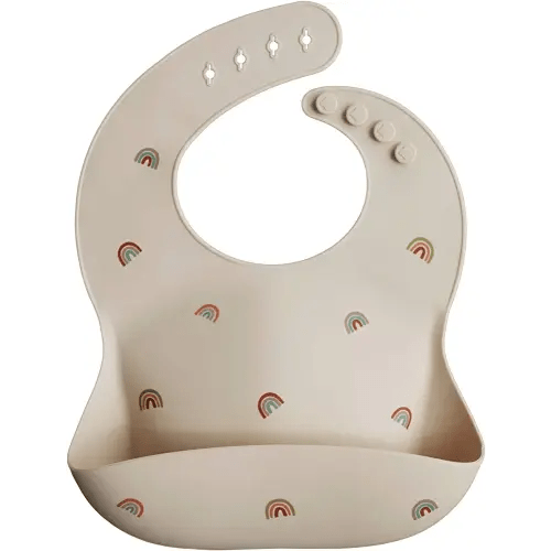mushie Silicone Baby Bib | Adjustable Fit Waterproof Bibs (Rainbows)