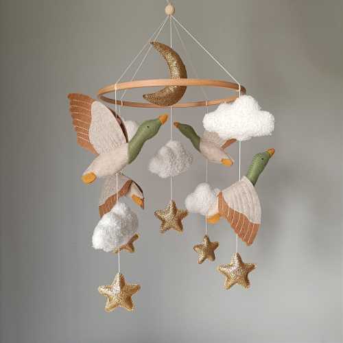 Baby crib mobile with geese flying in the clouds, baby shower gift