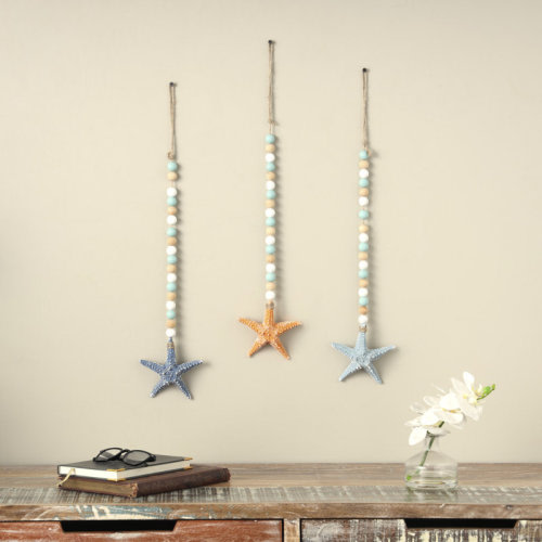 Highland Dunes Wood Handmade Textured Starfish Blue Wall Decor with Long Beaded Hanging Rope | Wayfair