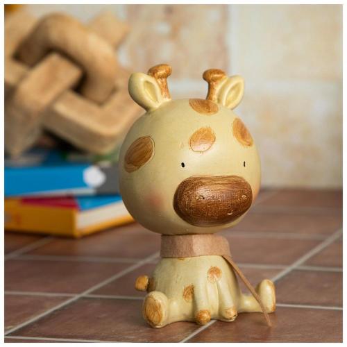 Sitting Giraffe Wearing Scarf
