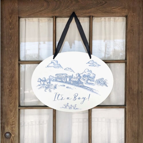 Storyland Toile New Baby Announcement Door Hanger - ZukaBaby