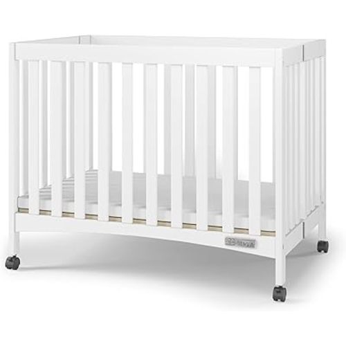 Child Craft London Mini Compact Folding Portable Crib with 2” Crib Mattress and 2 Easy Roll Locking Wheels, Durable Pine Wood Construction (Matte White)