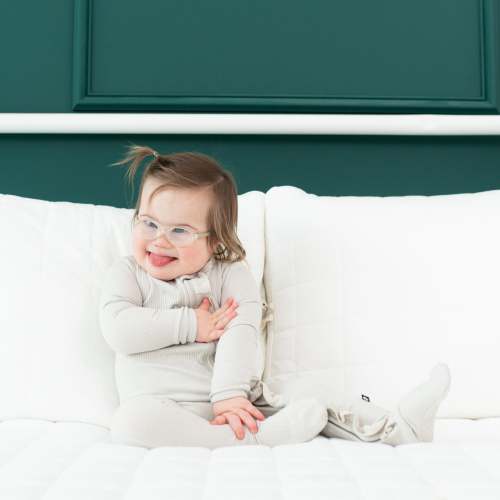 Ribbed Ruffle Bamboo Zipper Footie in Oat | Kyte Baby