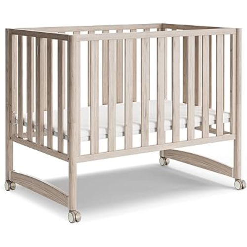 MAMAZING EvoNook 6-in-1 Convertible Mini Crib, 100% New Zealand Wood, Portable Mini Cribs with Wheels for Small Spaces, GREENGUARD Gold Certified, Washed Natural