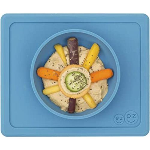 ezpz Mini Bowl for 12 Months+ (Blue) - 100% Silicone Suction Bowl with Built-in Placemat for Toddlers - Comes with a Reusable Travel Bag