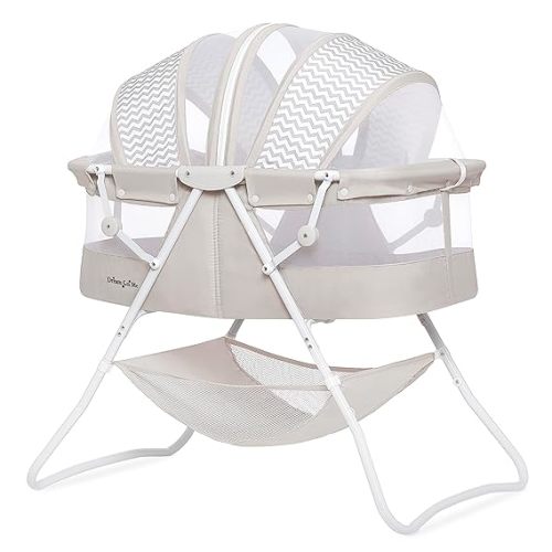 Karley Bassinet in Grey, Lightweight Portable Baby Bassinet, Quick Fold and Easy to Carry , Adjustable Double Canopy, Indoor and Outdoor Bassinet with Large Storage Basket.
