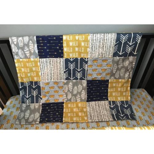 Where the Wild Things Are inspired crib bedding set in navy, gray and a golden yellow with woodland fabrics of arrows, crowns, tans trees
