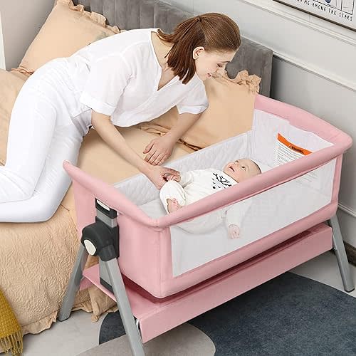 INFANS Baby Bassinet Bedside Crib, Newborn Sleeper w/Large Storage Basket, Adjustable Heights, Detachable &Washable Mattress, Breathable Mesh, Straps, Easy Moving Bed Side (Pink)